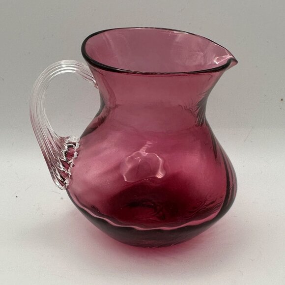 Unbranded hand blown cranberry w/ clear applied handle 3.75” mini glass pitcher - Picture 2 of 7